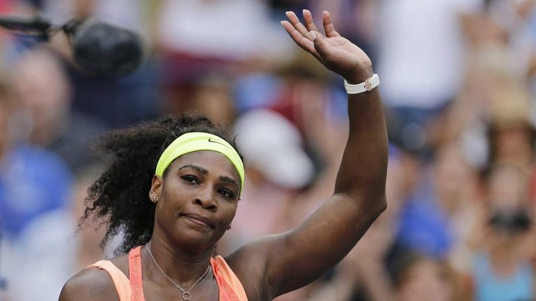 Serena Williams, of the United States, waves to fans after...