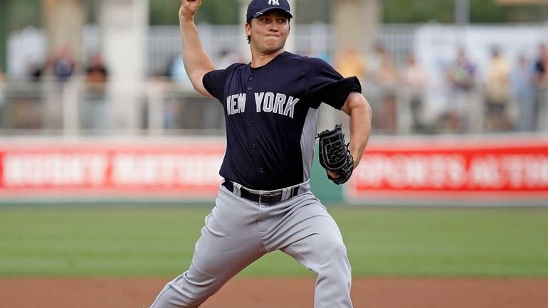 Adam Warren of the Yankees pitches against the Boston Red...