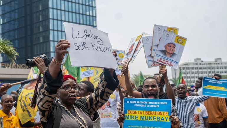 Political activists join in a sit-in protest calling for the...