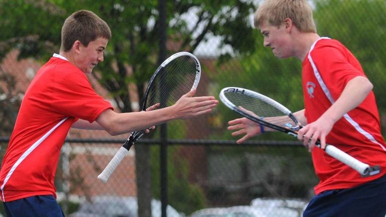 Cold Spring Harbor teammates Conor Mullins, left, and Tim Schnier...