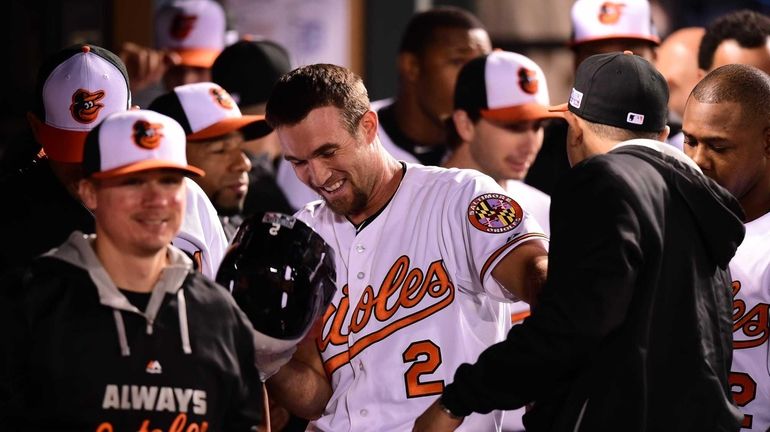 J.J. Hardy of the Baltimore Orioles celebrates with his teammates...