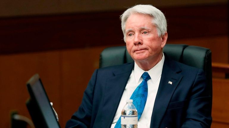 Claud "Tex" McIver, listens during closing arguments in a trial...