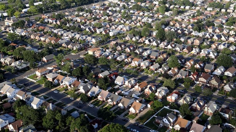 A neighborhood of houses in Elmont, NY is seen in...