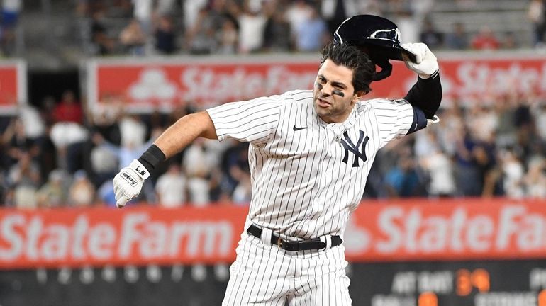 The Yankees' Ryan LaMarre reacts after he hits a walk-off...