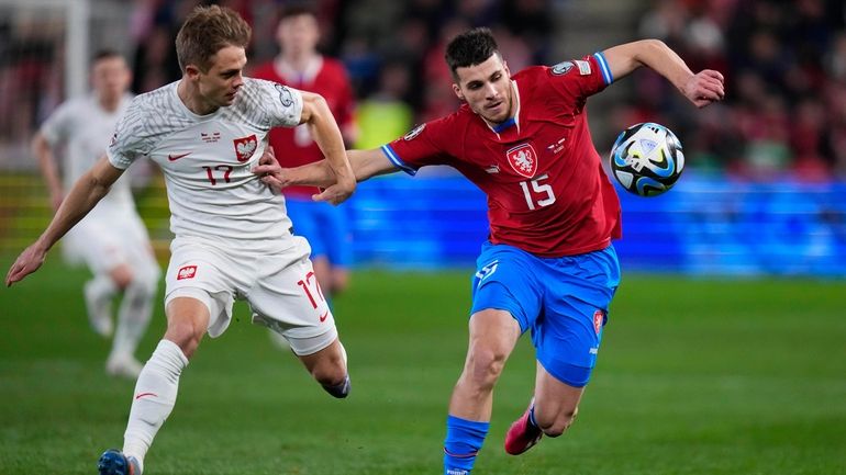 Czech Republic's David Jurasek, right, and Poland's Robert Gumny vie...