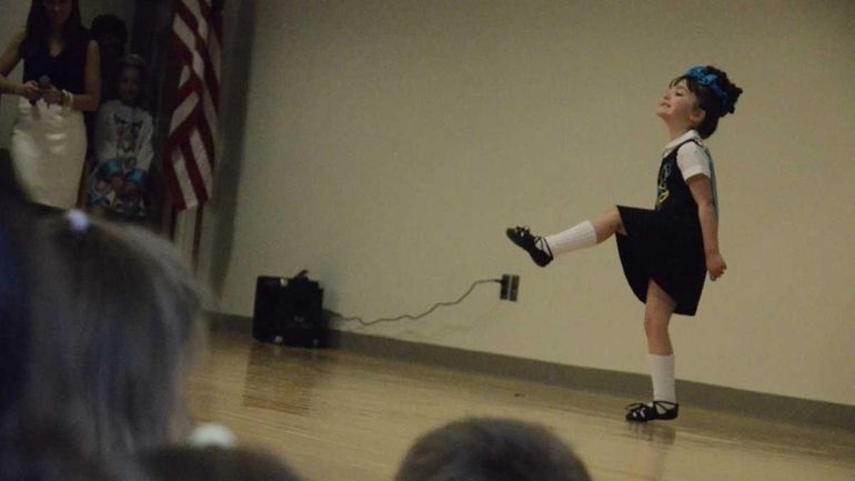 Shannon Abraldes, 5, of Holbrook, performs an Irish dance during...