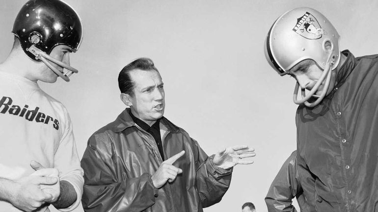 In this Dec. 18, 1963 file photo, Al Davis, center,...