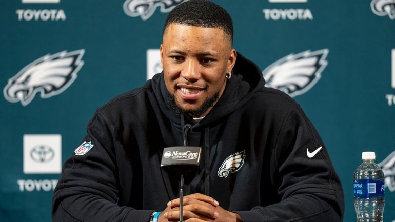 Philadelphia Eagle's Saquon Barkley talks to the media during a...