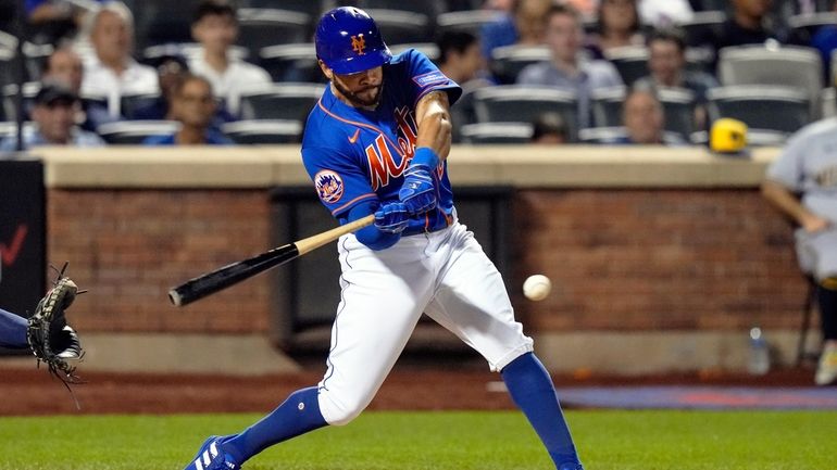 New York Mets' Tommy Pham hits a single during the...