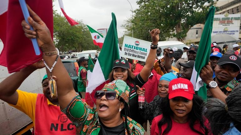 People protest against the recent increase in the electricity tariff,...