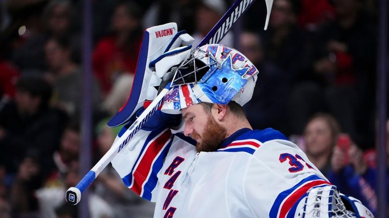 New York Rangers goaltender Jonathan Quick (32) pulls on his...