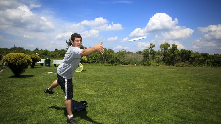 Tom Cunningham of Lindenhurst practices before the start of the...