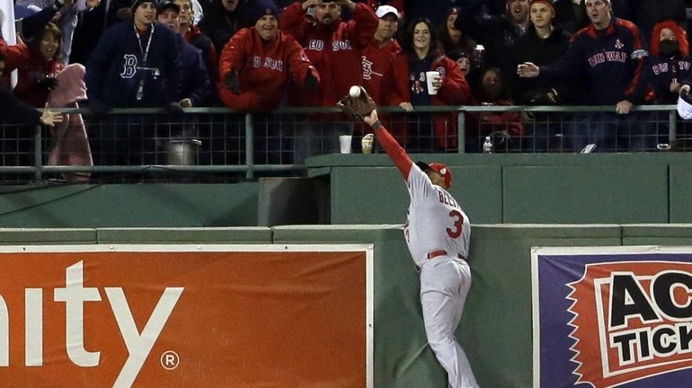 St. Louis Cardinals' Carlos Beltran makes a catch by Boston...