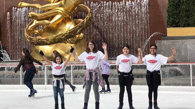 Kidsday reporters skating at Rockefeller Center Ice Rink. They are...