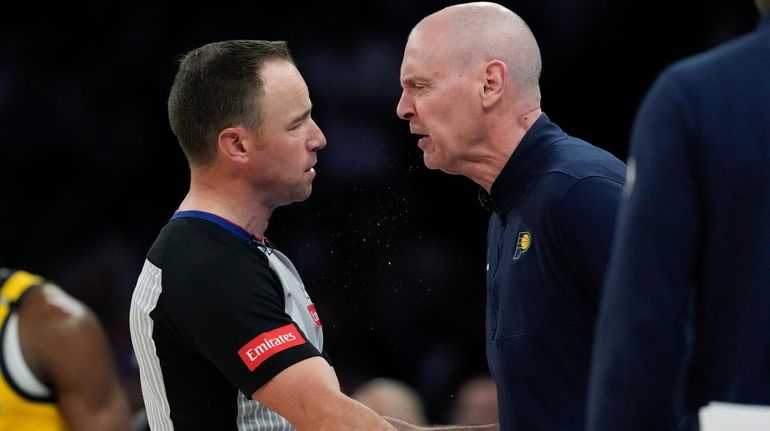 Indiana Pacers head coach Rick Carlisle, right, argues with a...