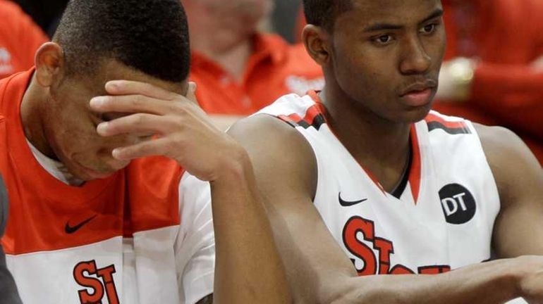 St. John's D'Angelo Harrison, left, and Moe Harkless, who fouled...