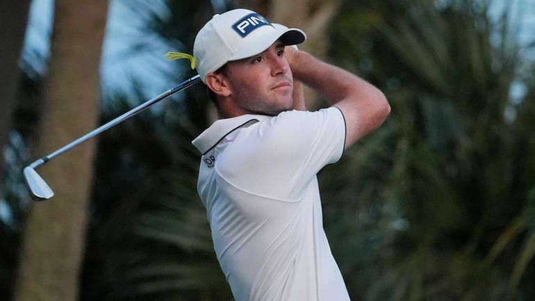 Austin Eckroat hits from the seventh tee during the final...