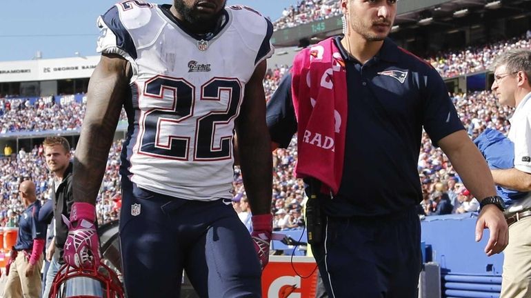 New England Patriots running back Stevan Ridley (22) is helped...