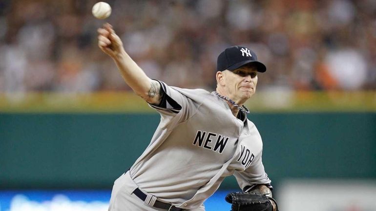 A.J. Burnett #34 of the New York Yankees throws a...