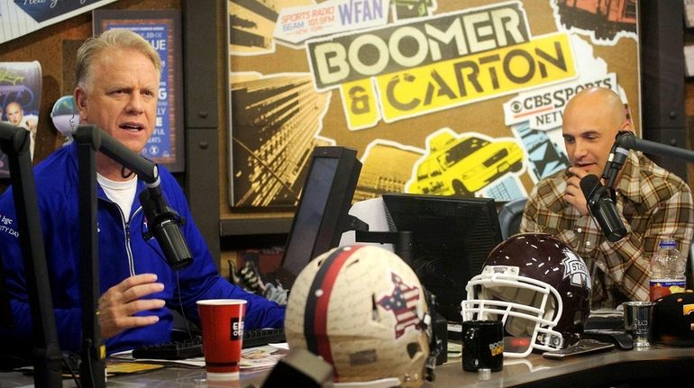 Boomer Esiason, left, and Craig Carton, right, host WFAN's morning...