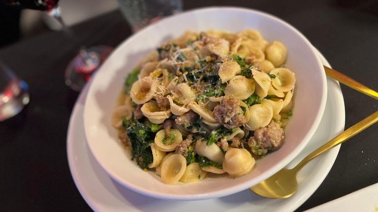 Classic orecchiette with broccoli rabe and crumbled Italian sausage at...