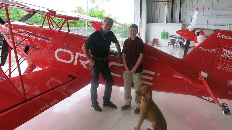 Pilot Sean D. Tucker and his dog, Levi, with Kidsday...