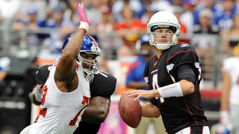 Kevin Kolb #4 of the Arizona Cardinals looks to pass...