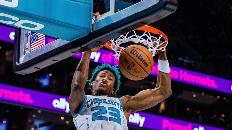 Charlotte Hornets forward Kai Jones dunks during the first half...