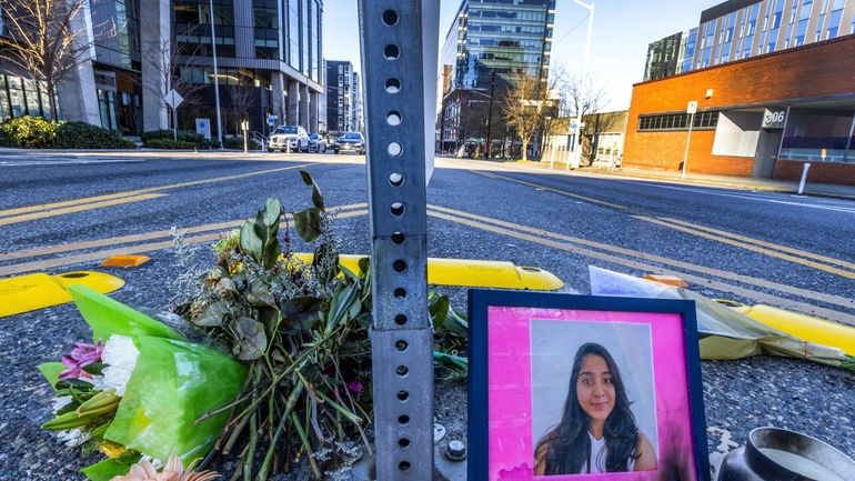 A photo of Jaahnavi Kandula is displayed with flowers, Jan....