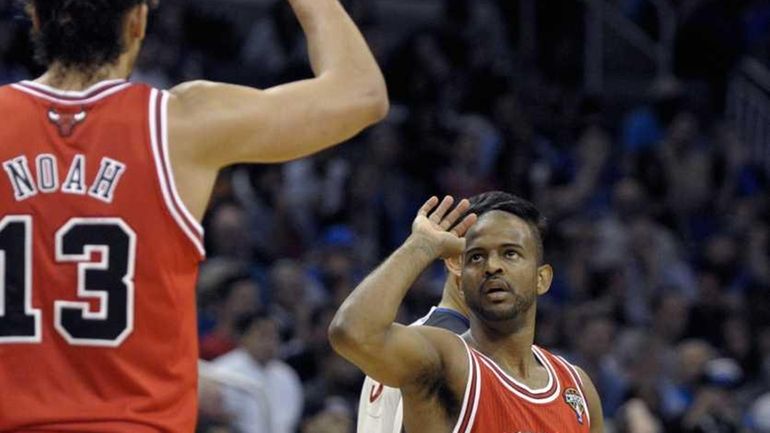 Chicago Bulls guard John Lucas III, right, is congratulated by...