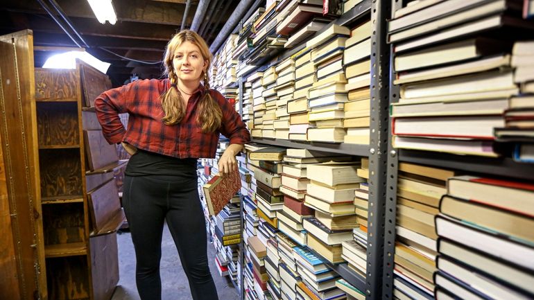 Former Book Revue rare book manager Mallory Braun in a warehouse...