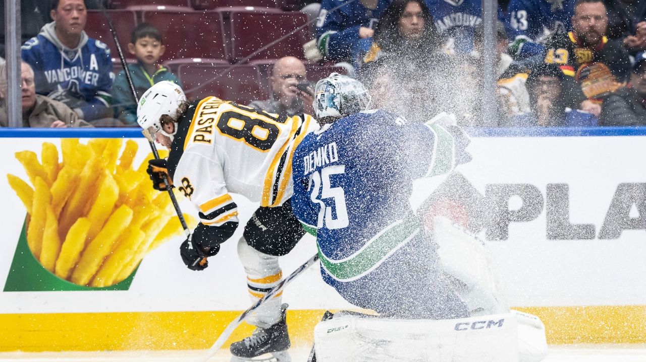 Pastrnak has goal and 3 assists as Bruins beat Canucks 5-1