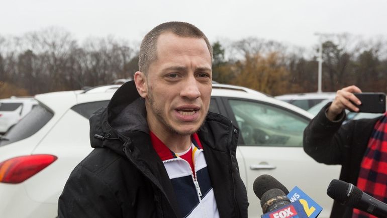 Christopher Loeb speaks to the media after former Suffolk District...