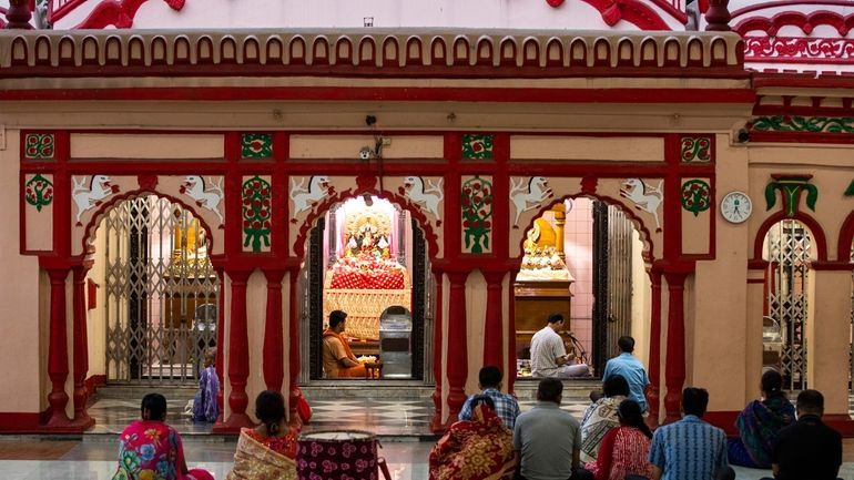 Hindu devotees pray at the Dhakeshwari National Temple in Dhaka,...