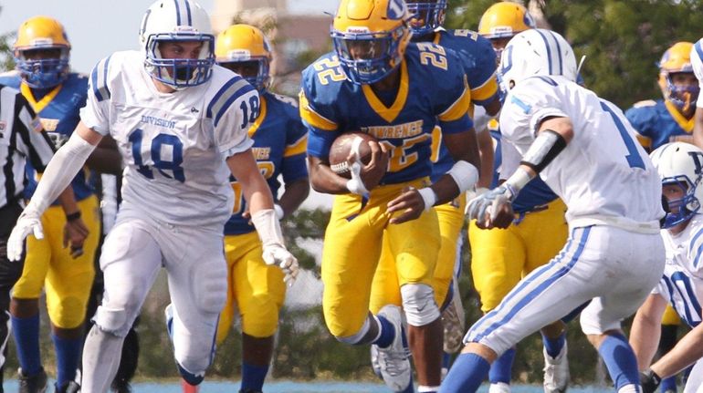 Chris Collier #22 of the Lawrence Golden Tornadoes runs the...