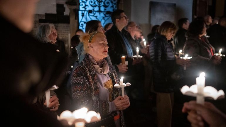 Faithful pray as they take part in a pro-life march...