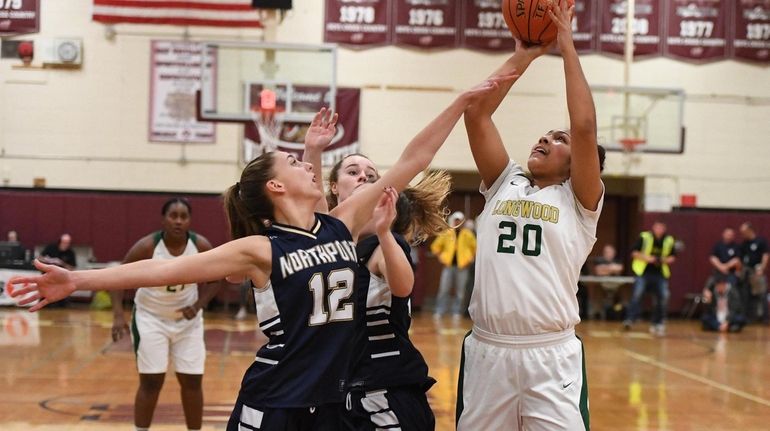 LongwoodÕs Tatiana Stevens shoots the ball defended by NorthportÕs Danielle...