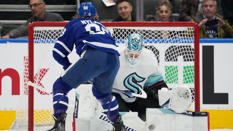 Seattle Kraken goaltender Martin Jones (30) stops Toronto Maple Leafs...