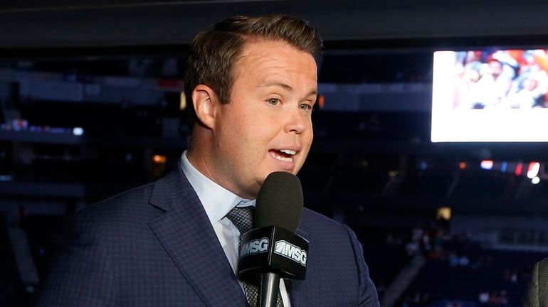 New York Islanders broadcaster Brendan Burke works a game at...