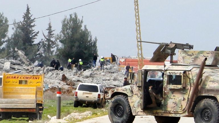 A Lebanese army vehicle block a road leading to a...