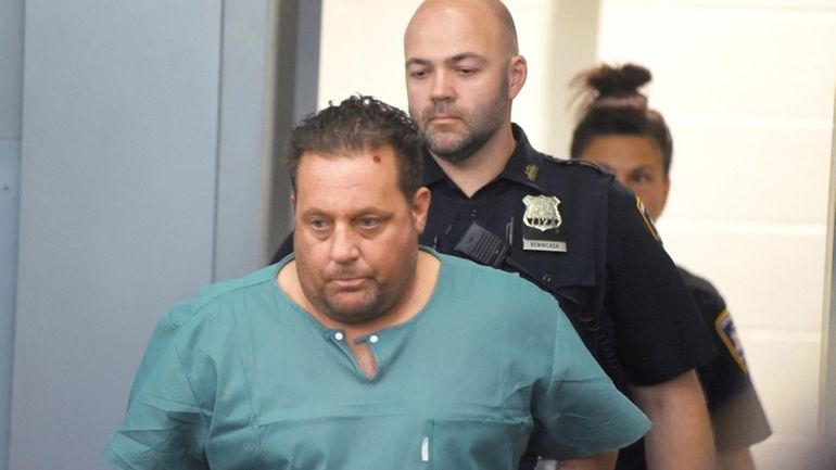 Daniel Coppola arrives at his arraignment in First District Court in...