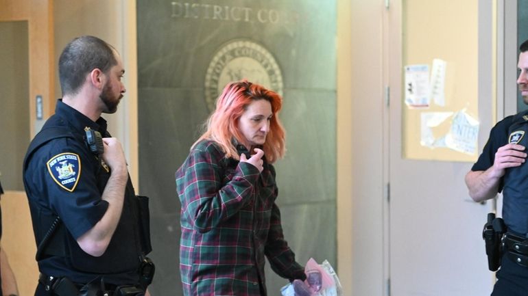 Amanda Wallace of Amityville, shown in March leaving court, admitted Tuesday...