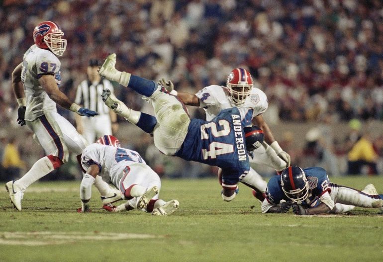 Defensive End Leon Seals of the Buffalo Bills and Quarterback Jeff News  Photo - Getty Images