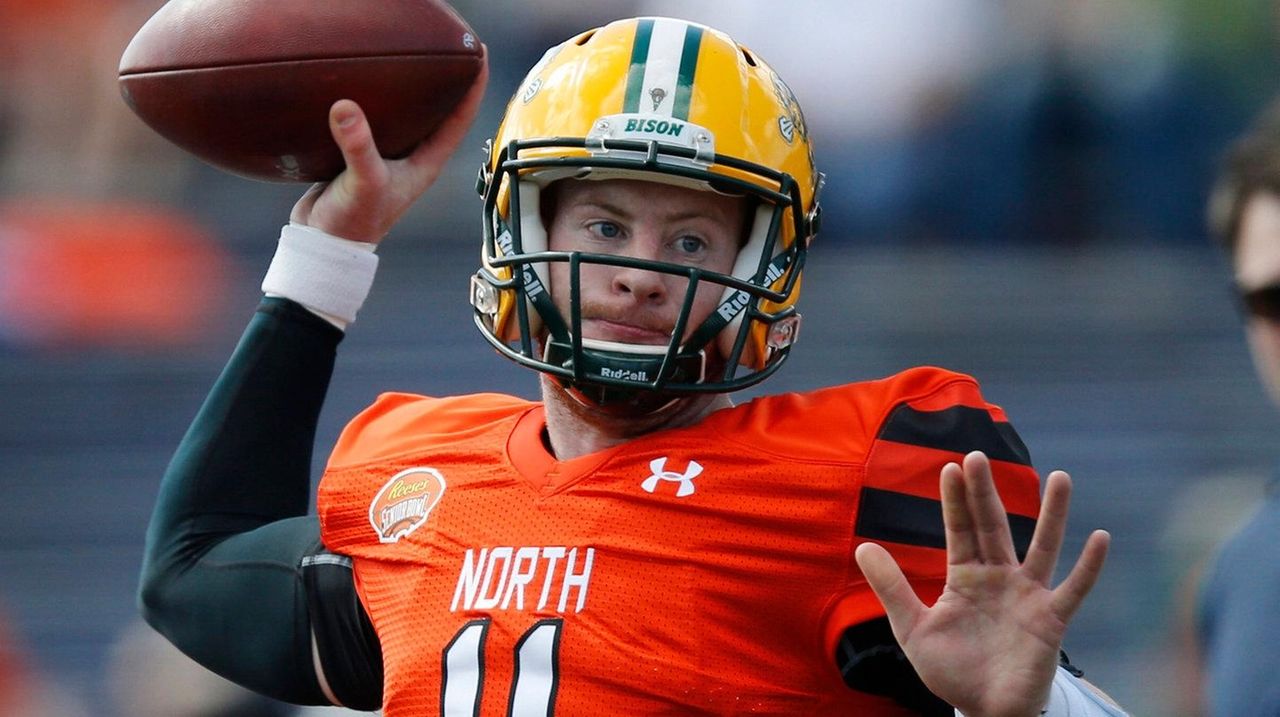 North Dakota State quarterback Carson Wentz holds his jersey after being  selected by the Philadelphia Eagles with the second overall pick in the  2016 NFL Draft on April 28, 2016 in Chicago.