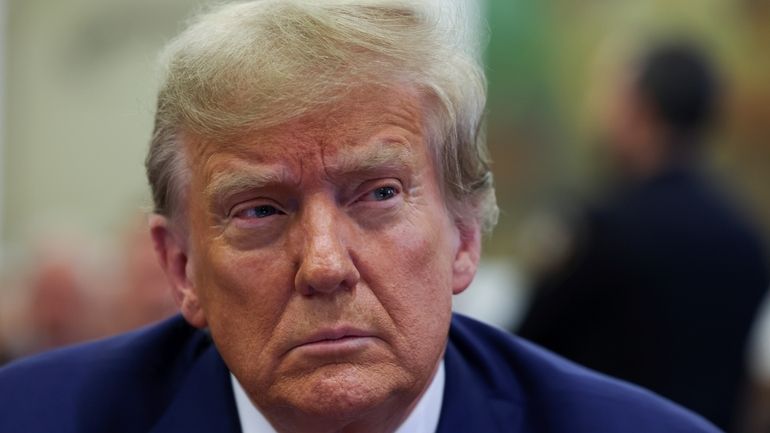 Former U.S. President Donald Trump attends the closing arguments in...