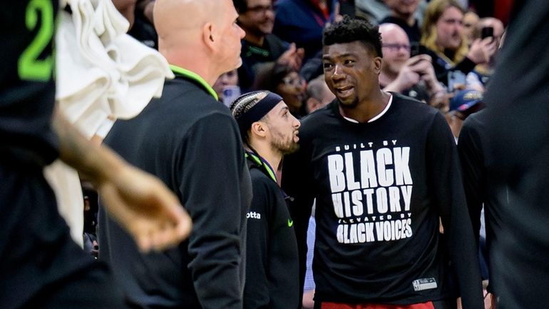 Miami Heat center Thomas Bryant, right, talks with New Orleans...