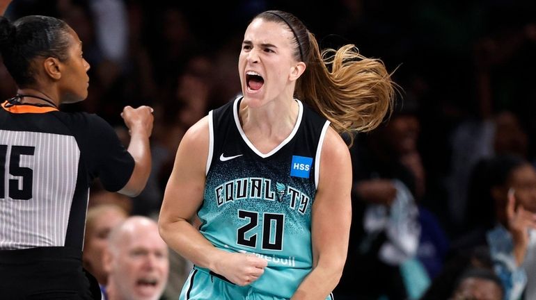 Liberty guard Sabrina Ionescu reacts after scoring against the Sun during...