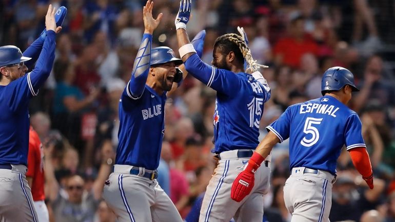 Toronto Blue Jays' Raimel Tapia (15) celebrates his inside-the-park grand...