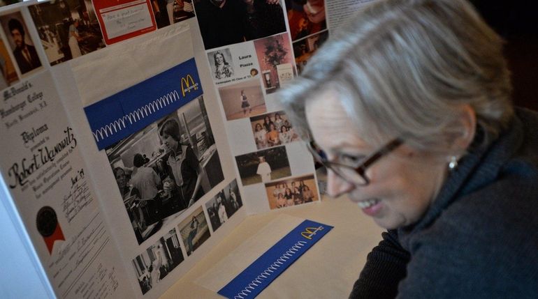 Denise Bundow, of Seattle, looks at a photo of herself...