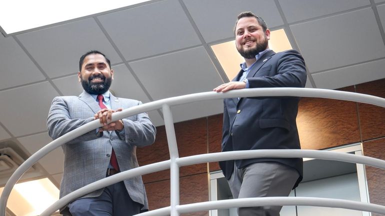 Imran Ansari, left, of the Long Island Federation of Labor, AFL-CIO,...